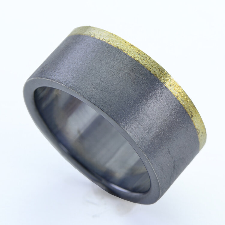 rings silver and gold carbon laminate
