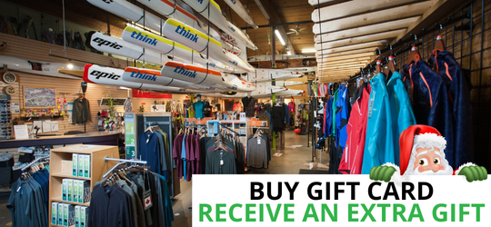 View of Coast Outdoors in store with gift card text