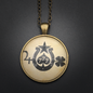 Luck Talisman in Antique Brass with Glass Cabochon