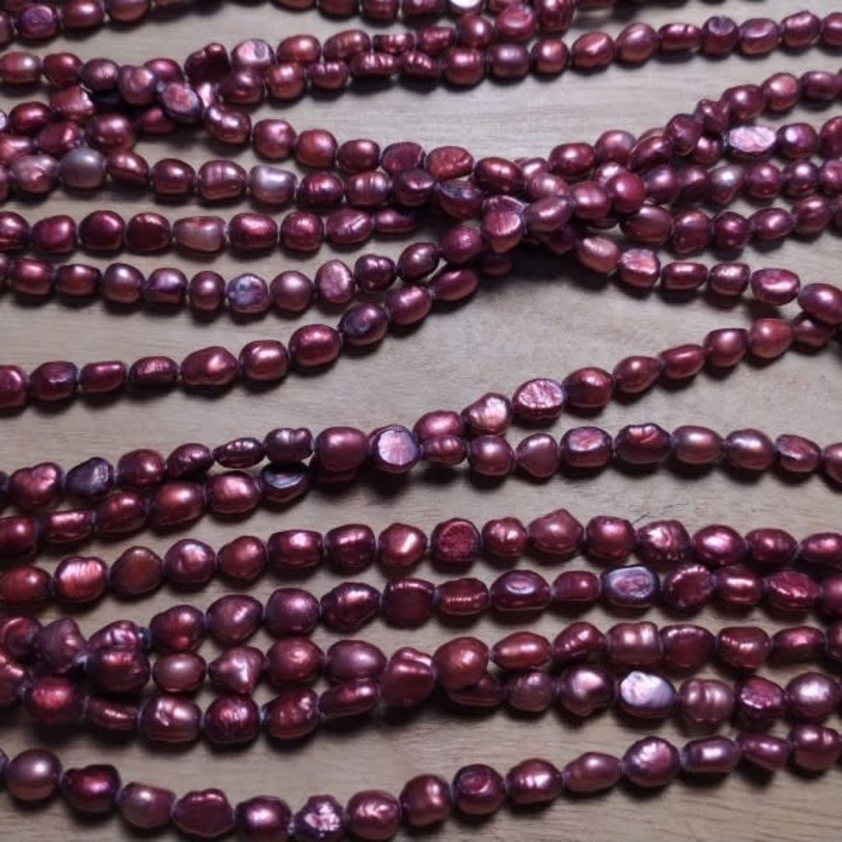 Freshwater Pearl strand - 4-6mm Flattish - red wine