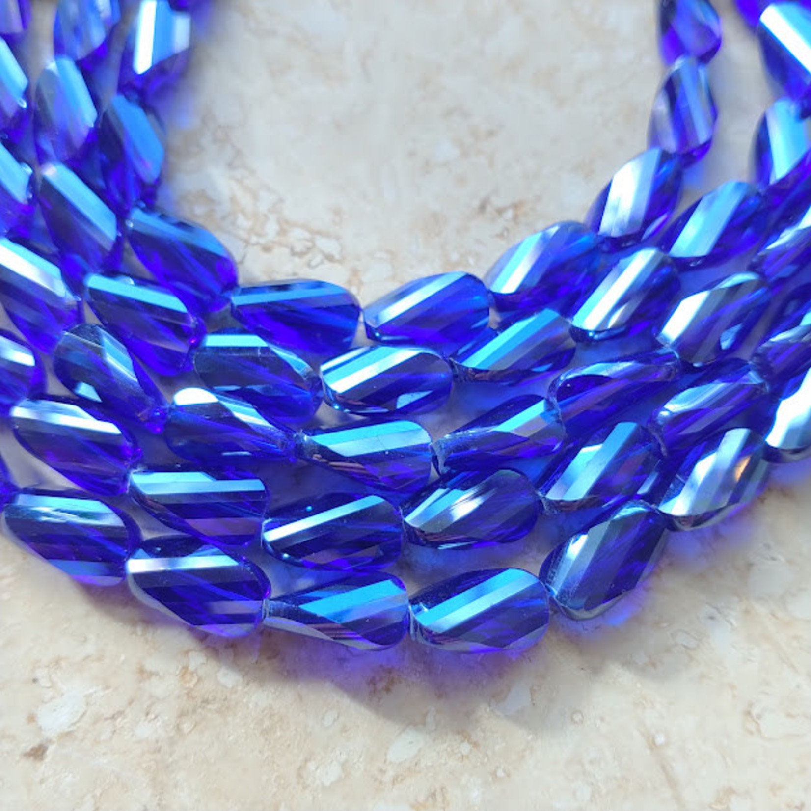 Faceted Crystal Twist 8x12 Cobalt Bead Strand of 11