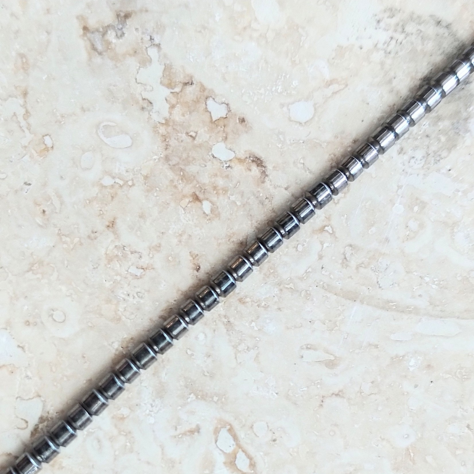 Hematite  2mm Barrel Gun Metal Bead Strand