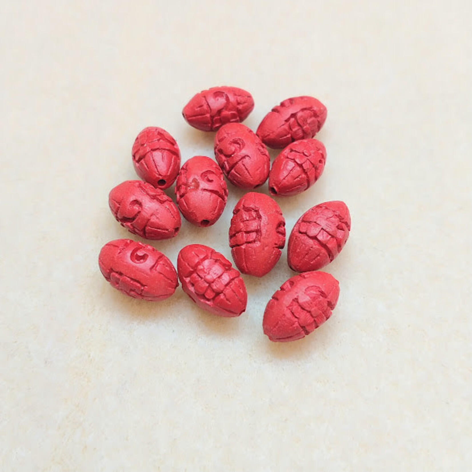 Cinnabar Colored Resin Oval 13x7mm Carved Flower Bead