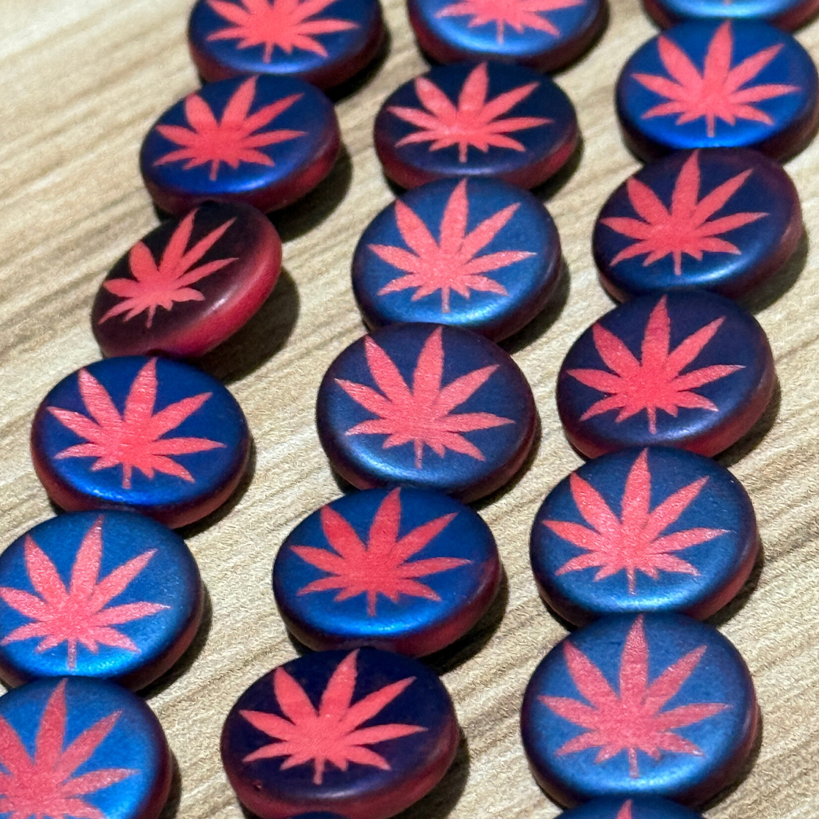 Czech Glass Coin Laser-Etched Blue and Red Marijuana Leaf Bead Strand