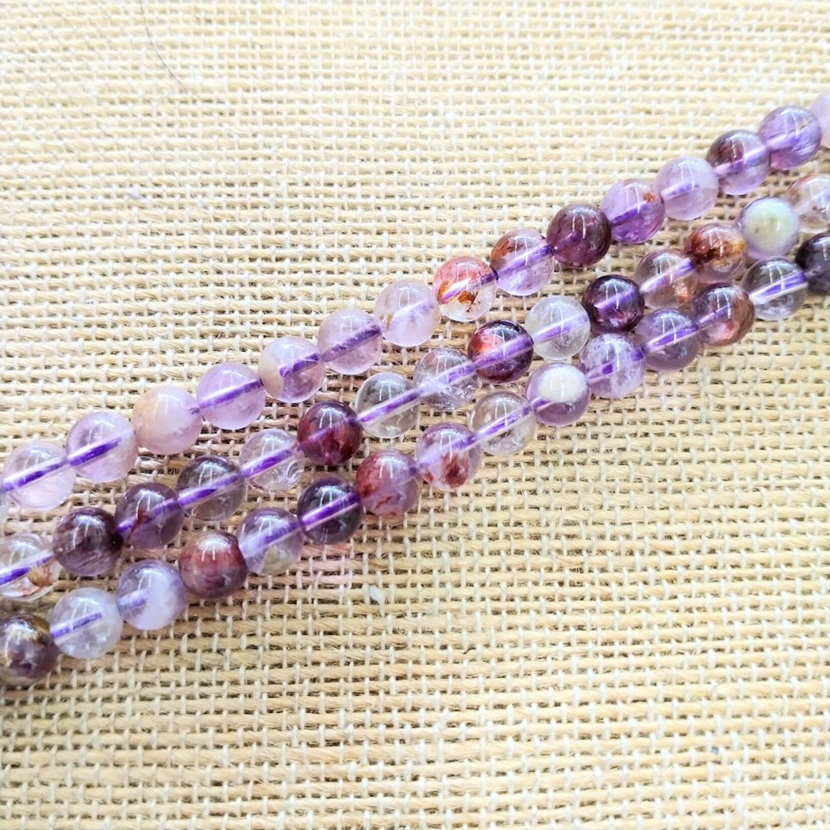 Super 7 -- Melody Stone -- 6mm Round Bead Strand