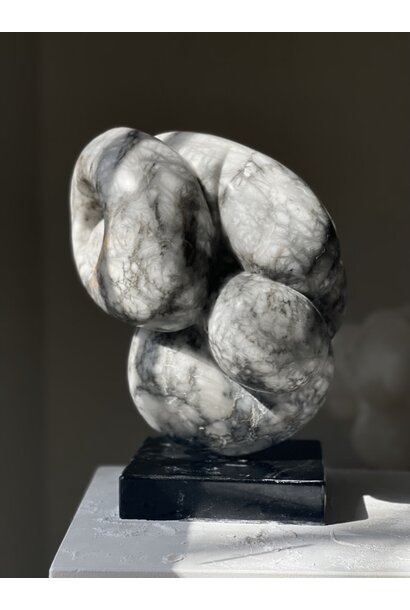 Carol Crawford - Megillah, 2023 - Italian Bardiglio alabaster on black granite base with brass turning pin - 36x28x18cm