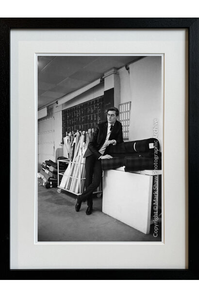 Mark Shaw - Yves St. Laurent Leans on Bolts of Fabric - 66x49.5cm framed - Black frame with non-reflective glass