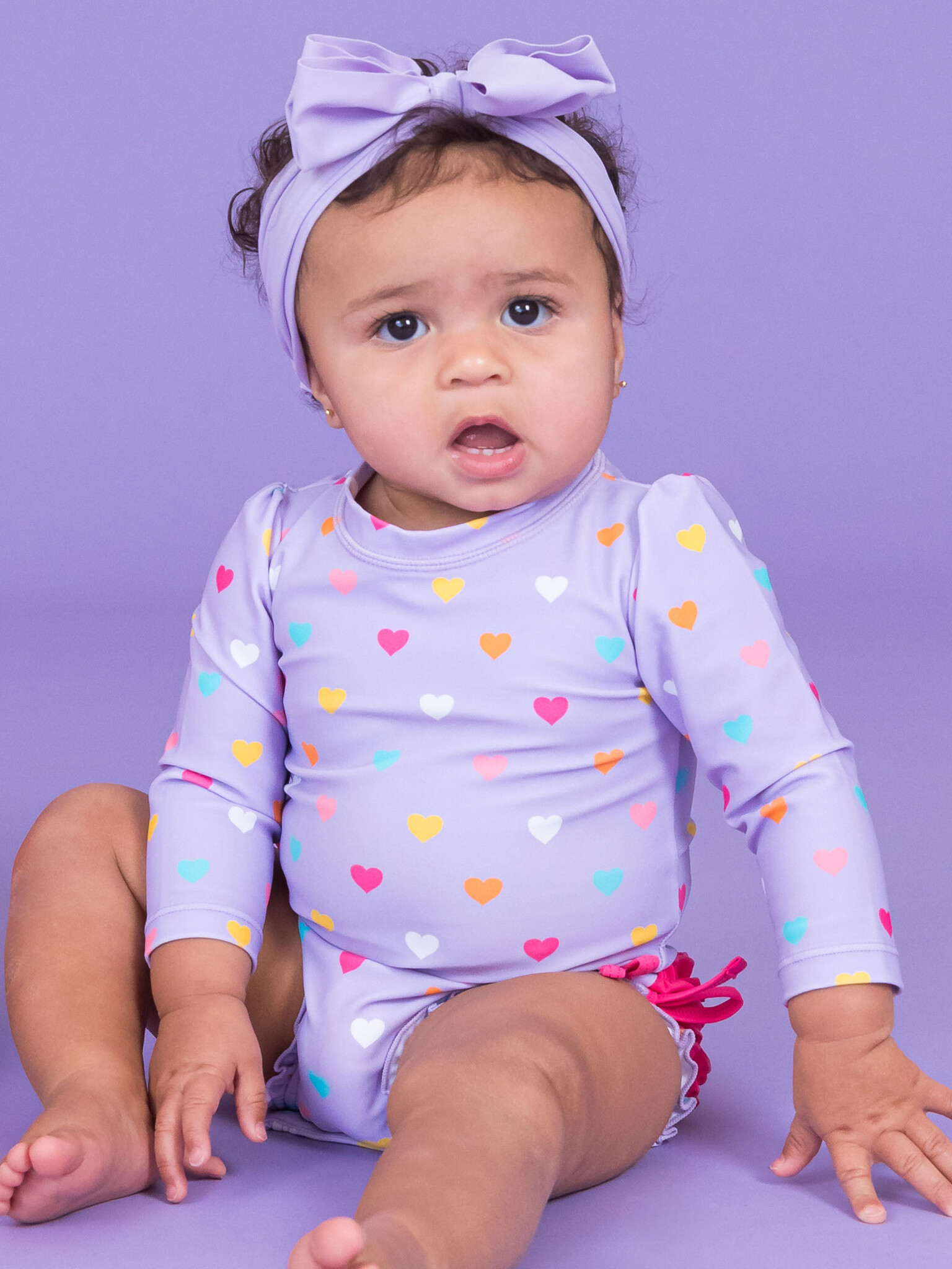 RuffleButts Rufflebutts Colorful Hearts Long Sleeve One Piece Rashguard