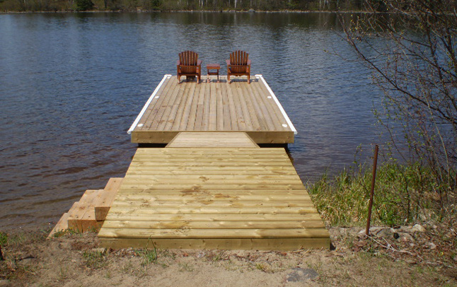 Dock installation on sand shoreline