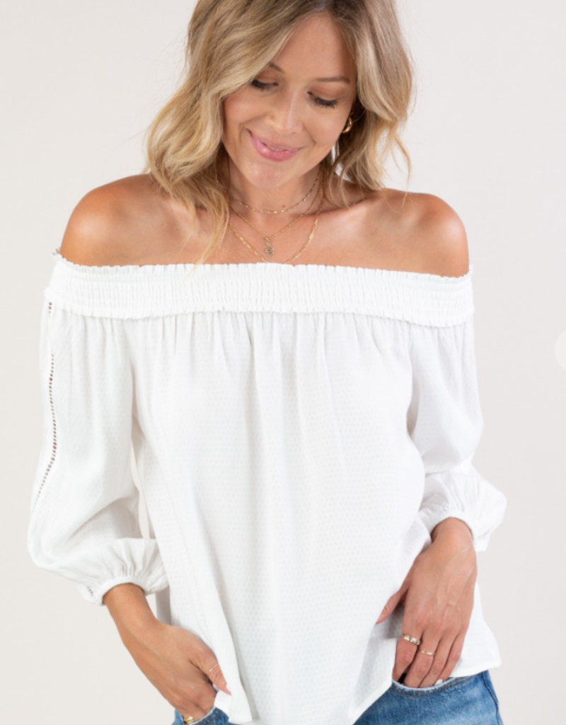 Love Stitch I-13278W-RFO Off the shoulder top with lattice trim detail. Features a 3/4 sleeve and elastic cuffs.