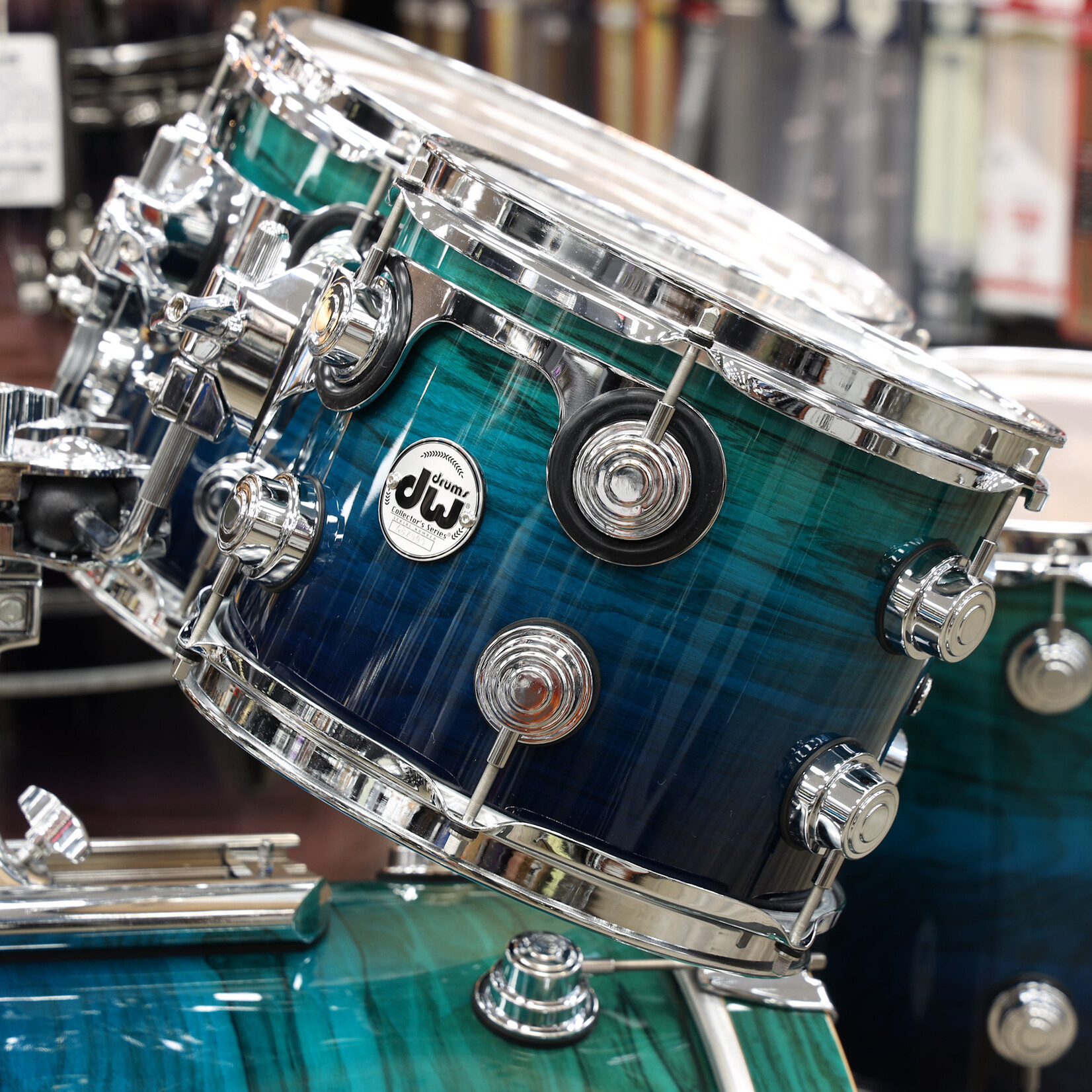 DW Pre-Owned DW Collector's Series Exotic 4-PC Shell Pack 10/12/14/22 (Blue Fade Lacquer on Olive Ash Burl)