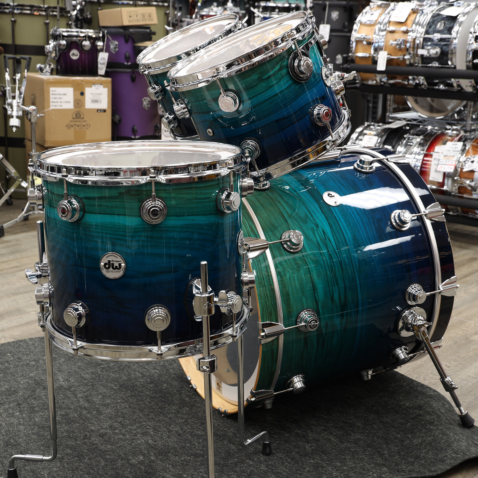 DW Pre-Owned DW Collector's Series Exotic 4-PC Shell Pack 10/12/14/22 (Blue Fade Lacquer on Olive Ash Burl)