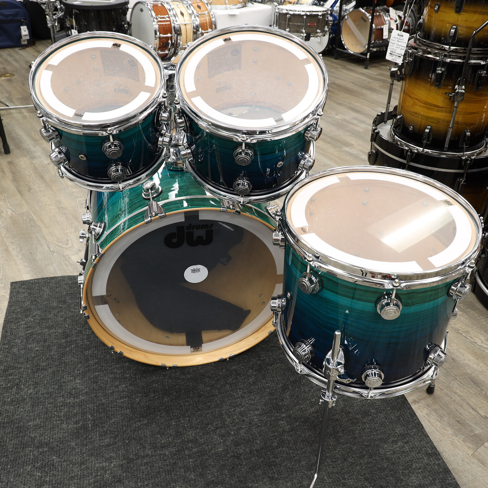 DW Pre-Owned DW Collector's Series Exotic 4-PC Shell Pack 10/12/14/22 (Blue Fade Lacquer on Olive Ash Burl)