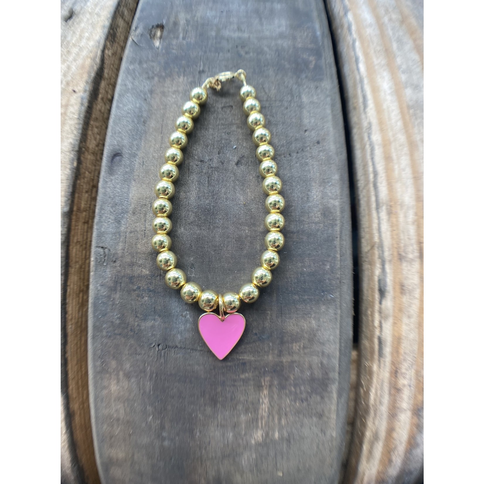 So Me So Me Designs| Heart of Gold: golden hematite beaded base with a pink enamel heart pendant, bracelet