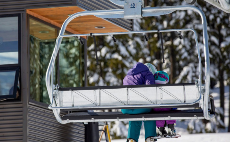 parent and child riding chairlift