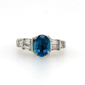 475291 14K WHITE GOLD .50TCW BAGUETTE AND PRINCESS CUT DIAMOND OVAL BLUE LONDON TOPAZ CENTER RING