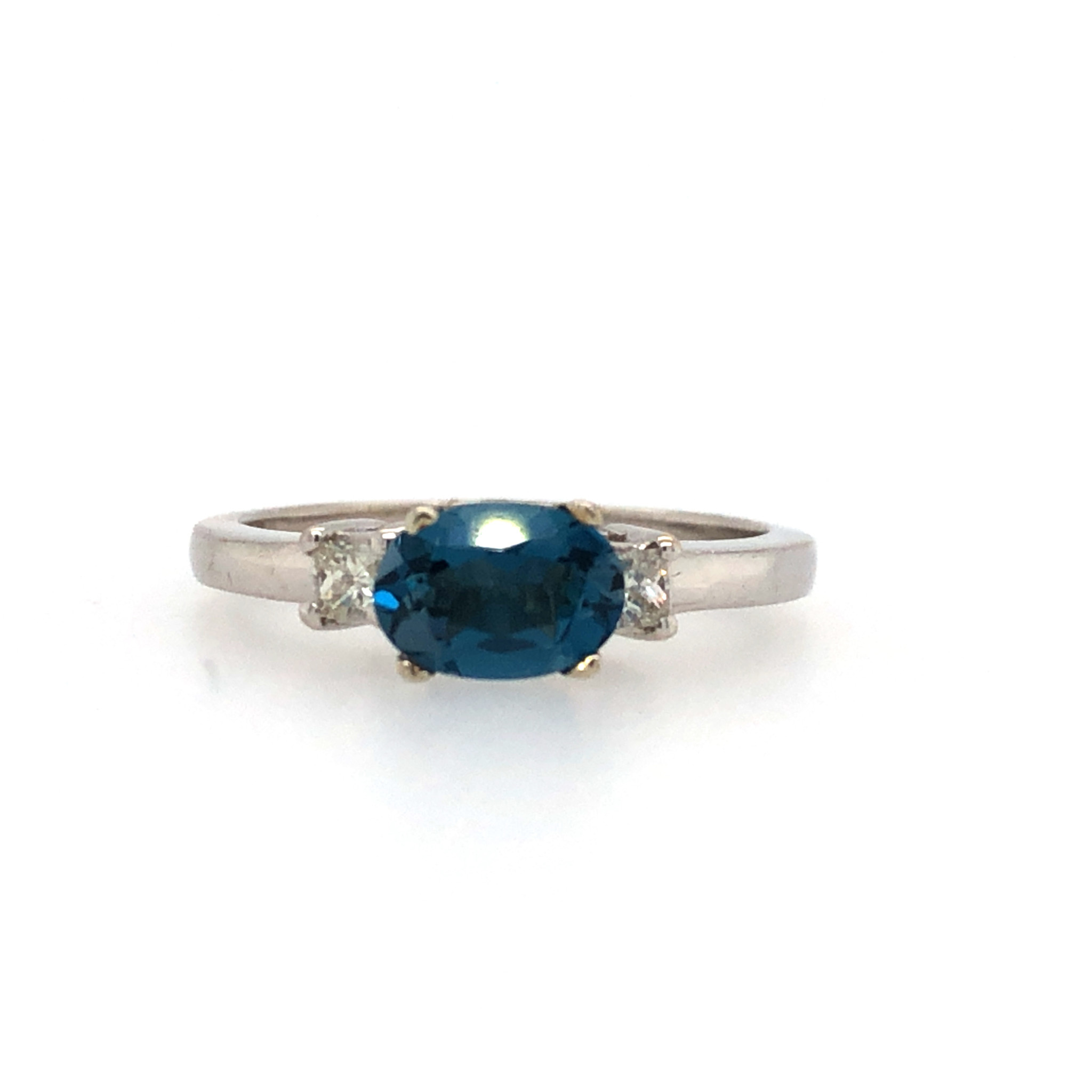 475058 14K WHITE GOLD OVAL BLUE LONDON TOPAZ WITH 2 PRINCESS CUT DIAMOND ON SIDES RING
