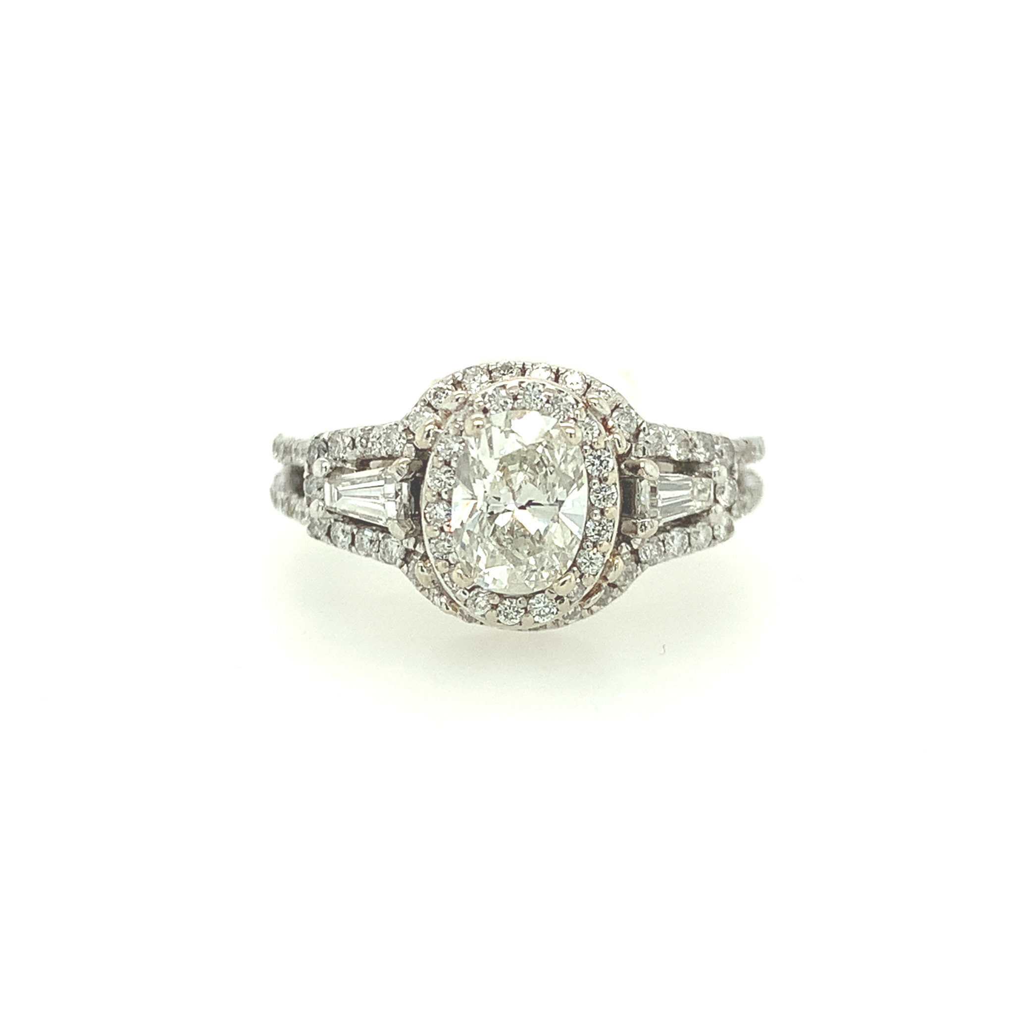 475011 14K WHITE GOLD .72CT J SI1 OVAL CENTER HALO RING WITH A SPLIT SHANK AND BAGUETTES ENGAGEMENT RING