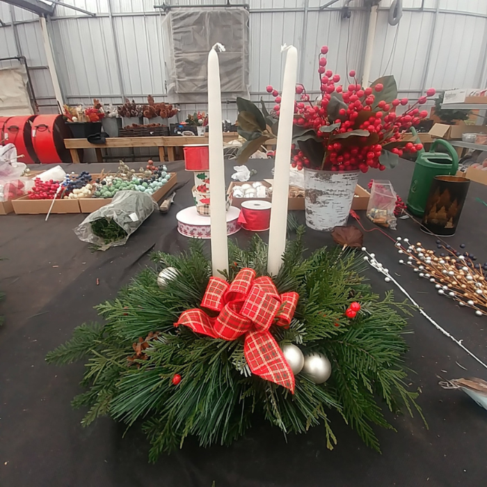Holiday centerpiece with fresh greens and candles