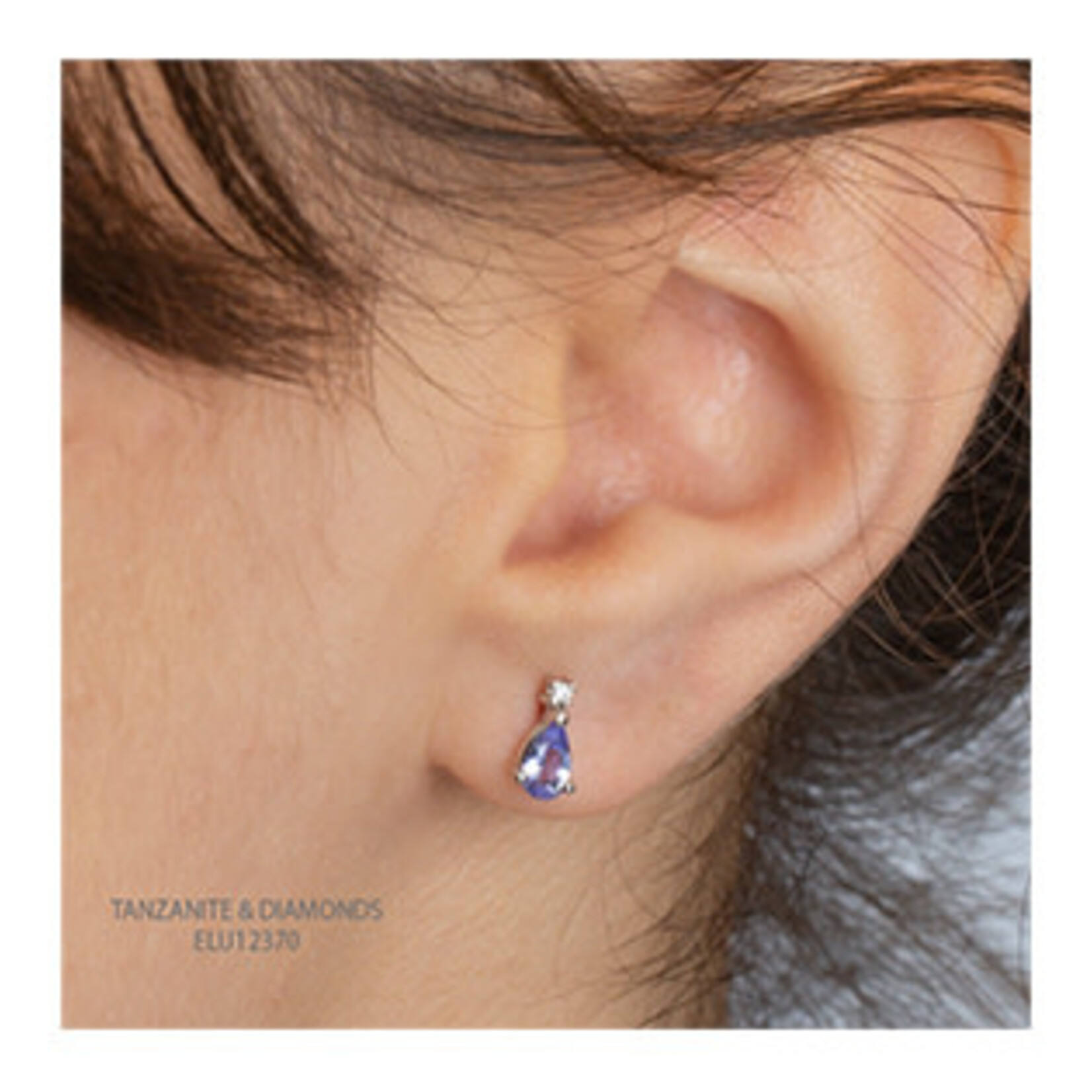 10K WG 2 Tanzanite 5x3mm 2 Diamond FC .02CT Earrings