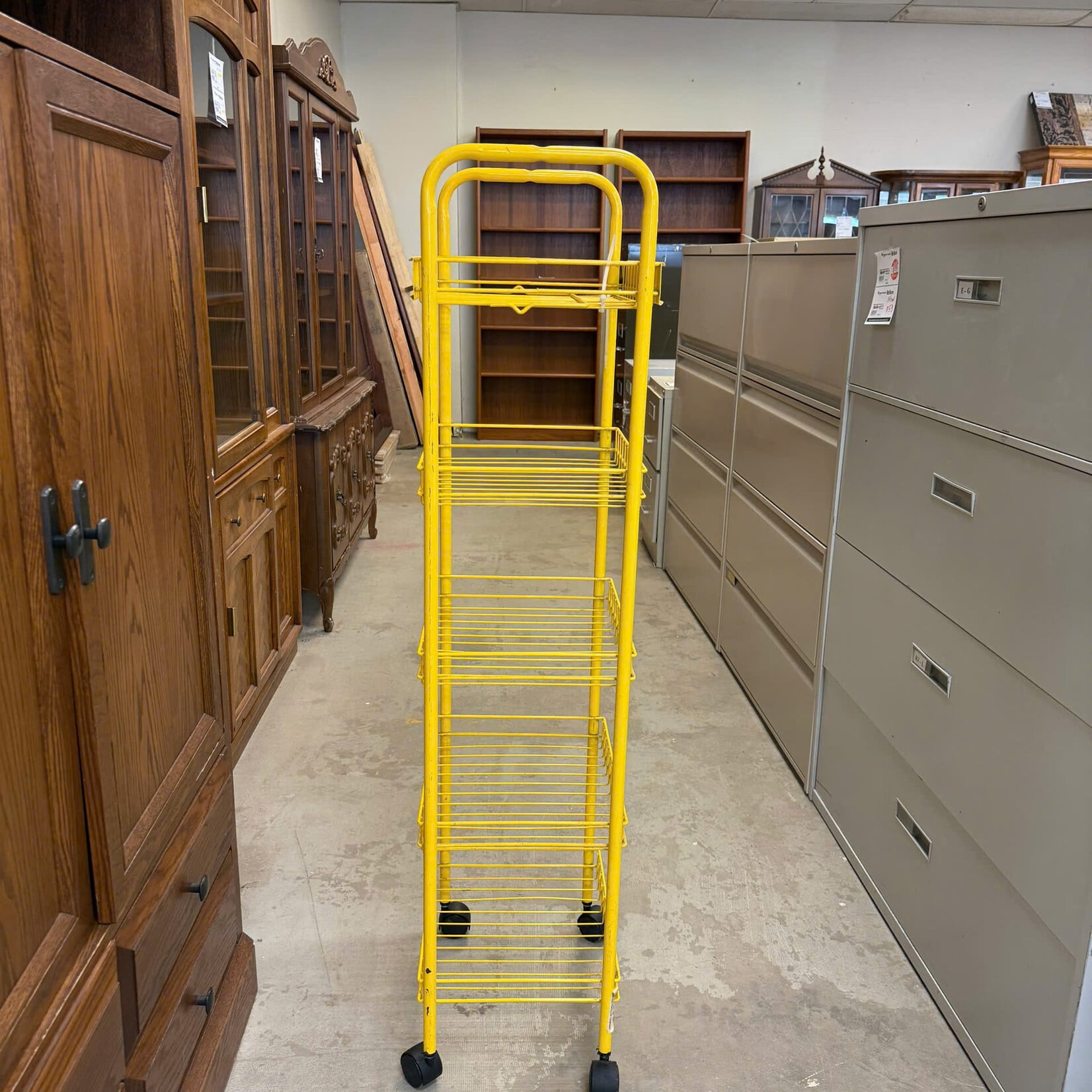 Yellow Metal Rolling Rack
