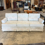 White Couch with Flower Design