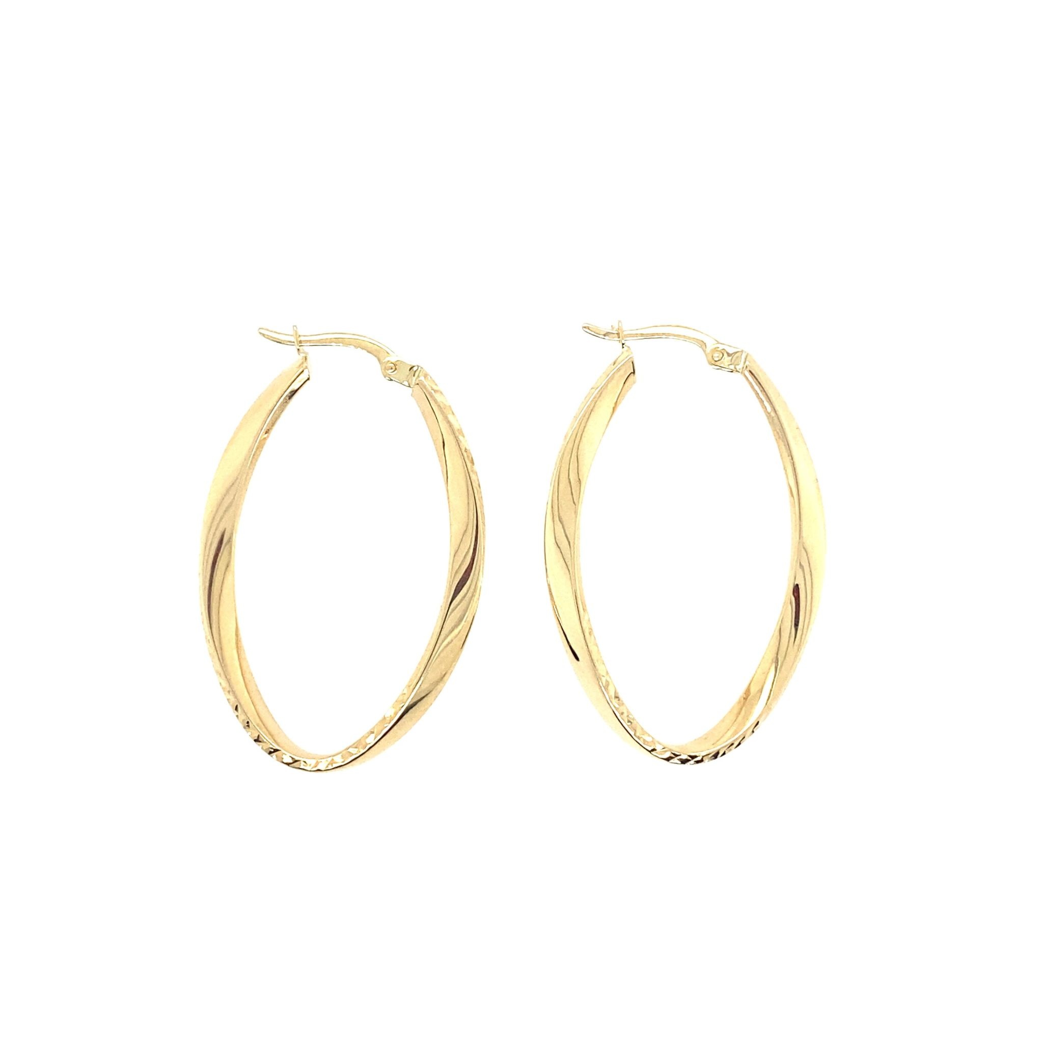 30264 14K YELLOW GOLD 1" WIDE-1.5" LONG TWISTED DIAMOND CUT AND HIGH POLISH OVAL HOOPS