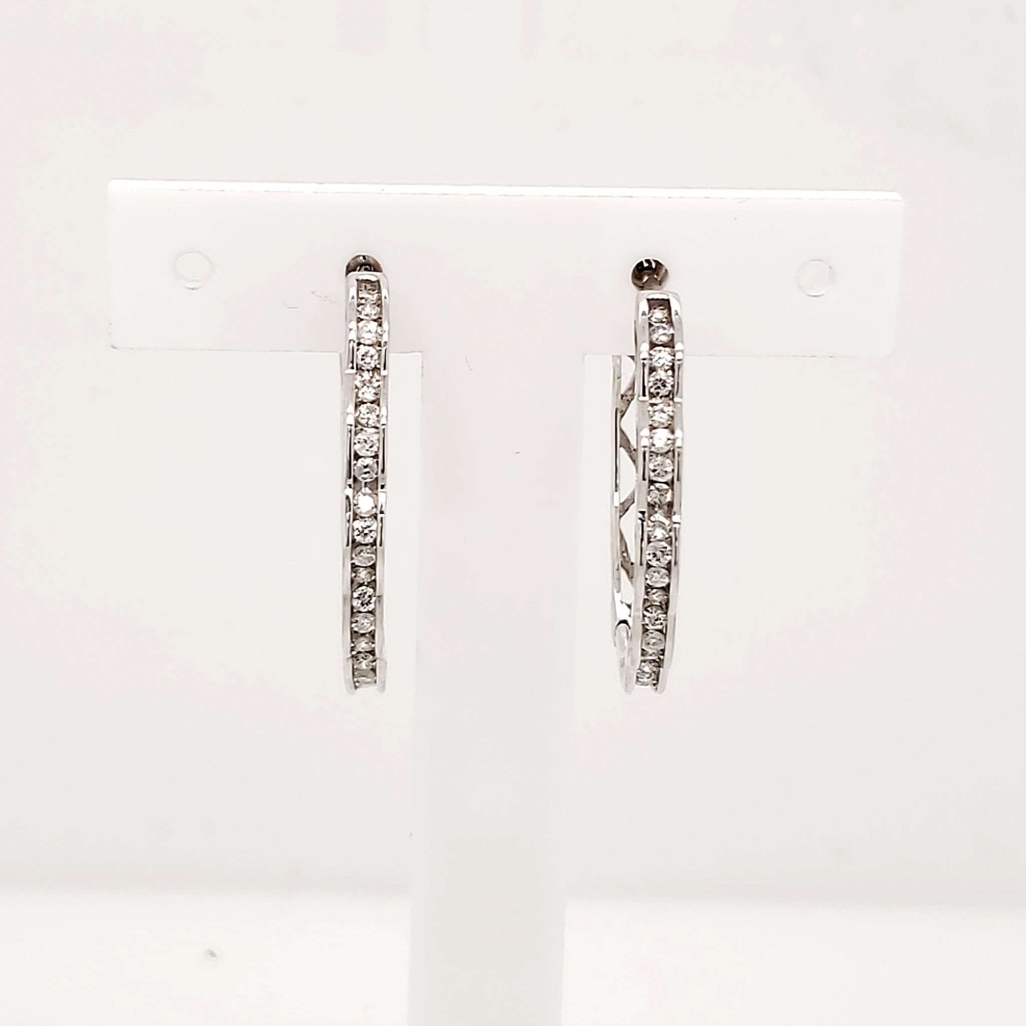 33036 14K. WHITE GOLD .50CT DIAMOND WAVE HOOPS