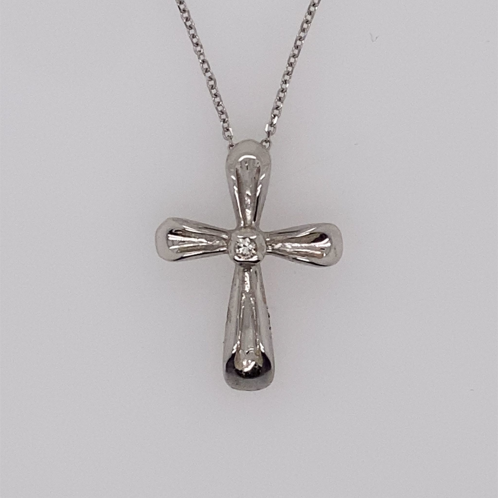 70847 14K WHITE GOLD .04CT DIAMOND CENTER HIGH POLISH CROSS PENDANT