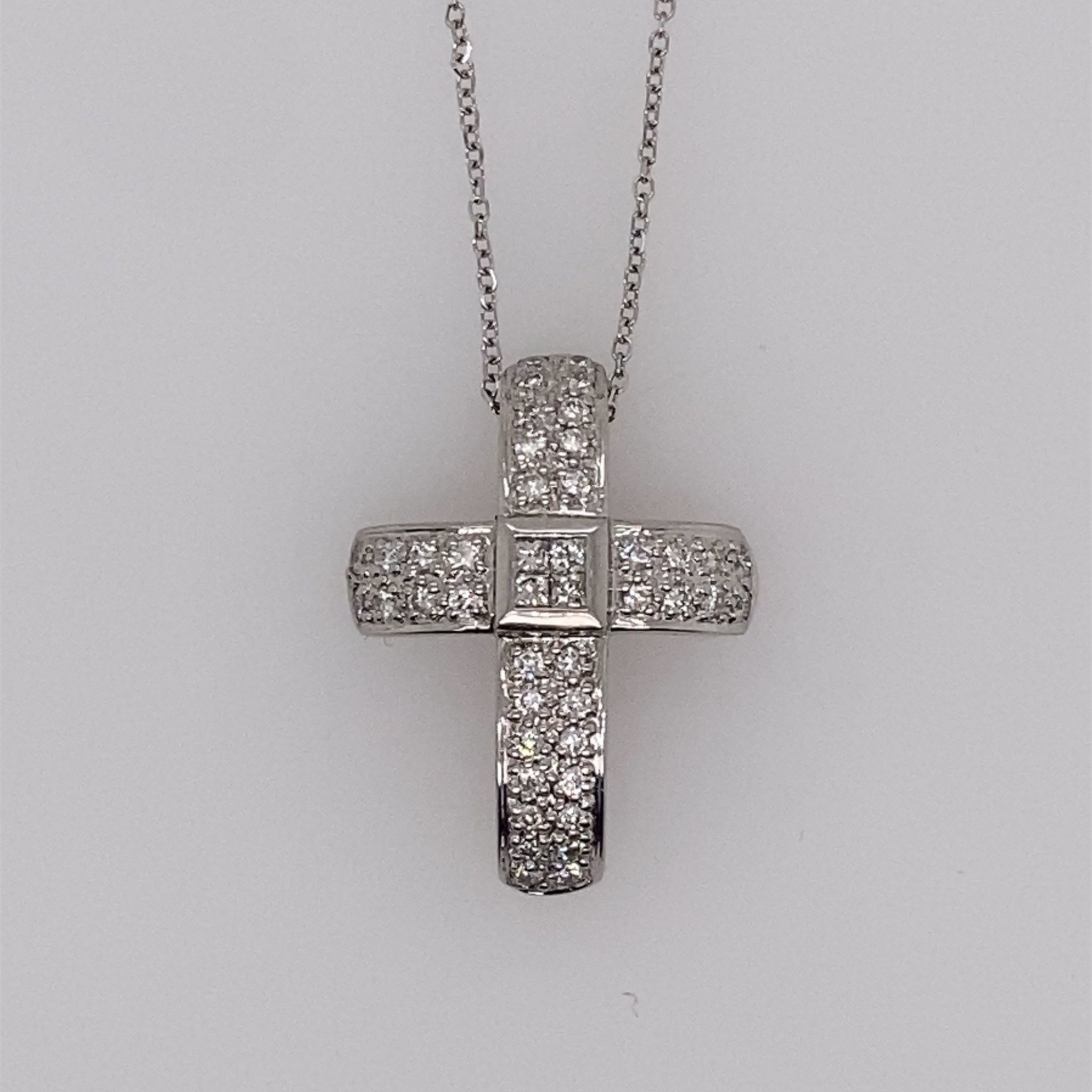 76078 14K WHITE GOLD .58CT DIAMOND INVISIBLE SET CROSS PENDANT