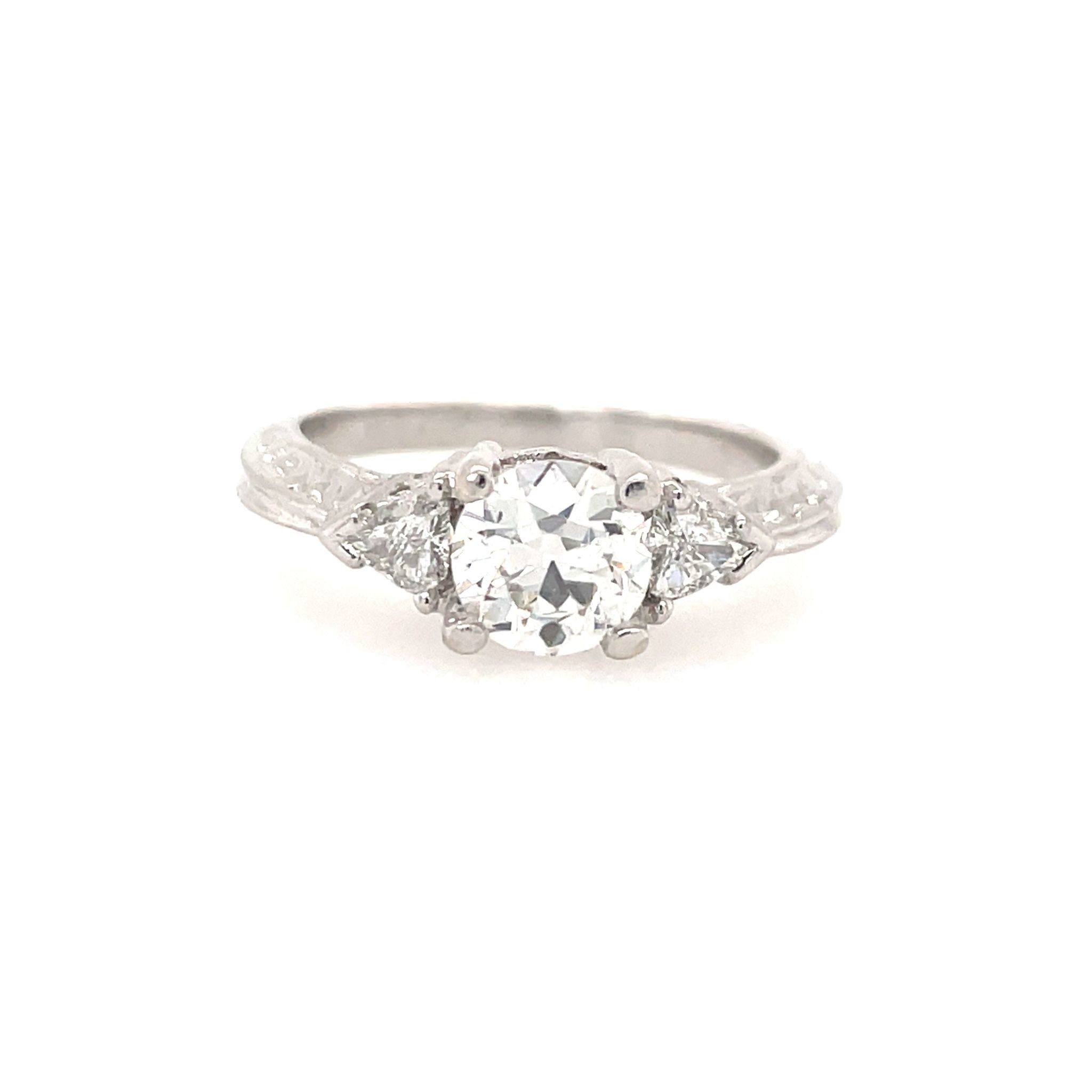 47559 18K WHITE GOLD .83TCW ROUND CENTER DIAMOND AND .25TCW TRILLION DIAMOND CATHEDRAL DESIGN ENGAGEMENT RING