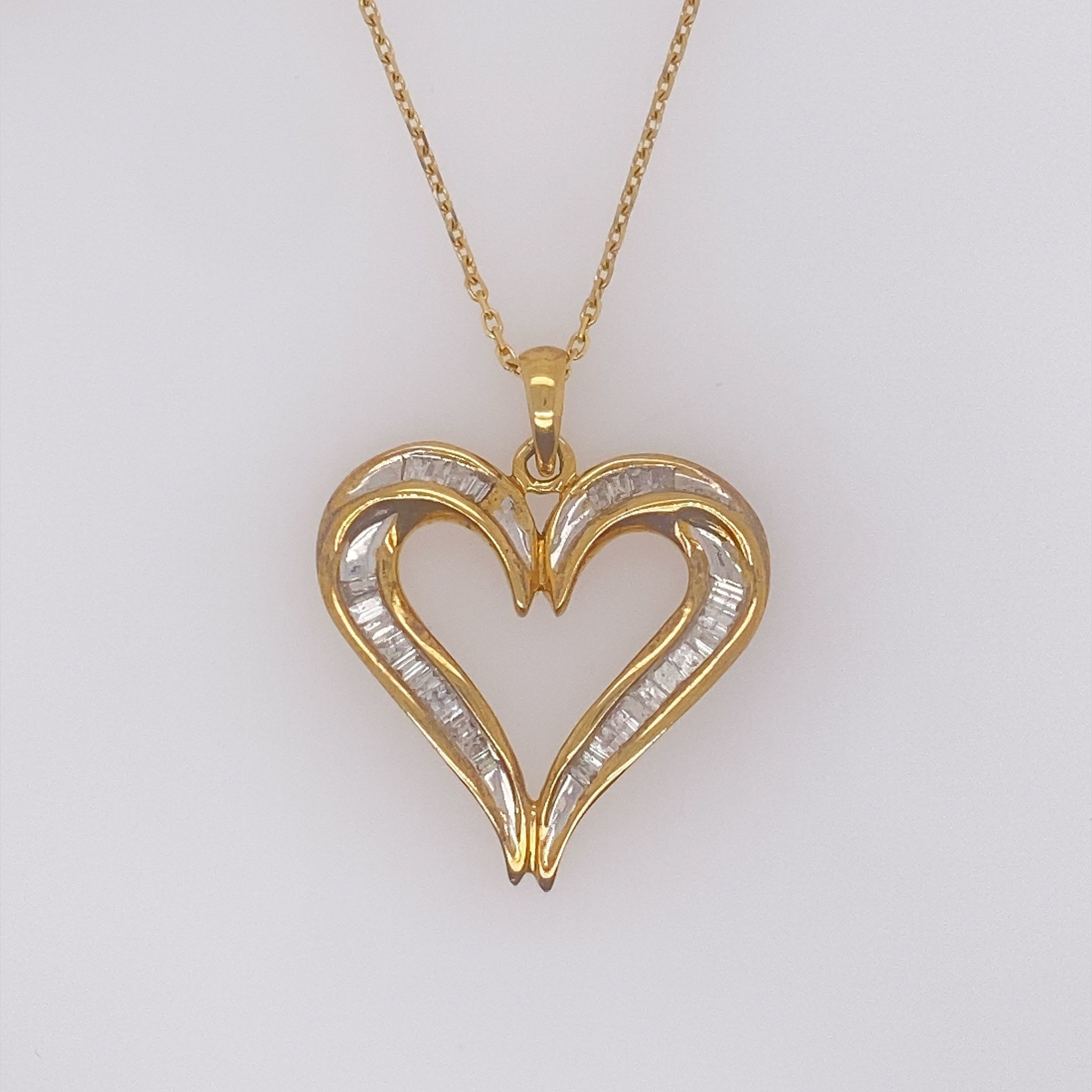 70745 14K YELLOW GOLD DIAMOND BAGUTTE OPEN HEART PENDANT