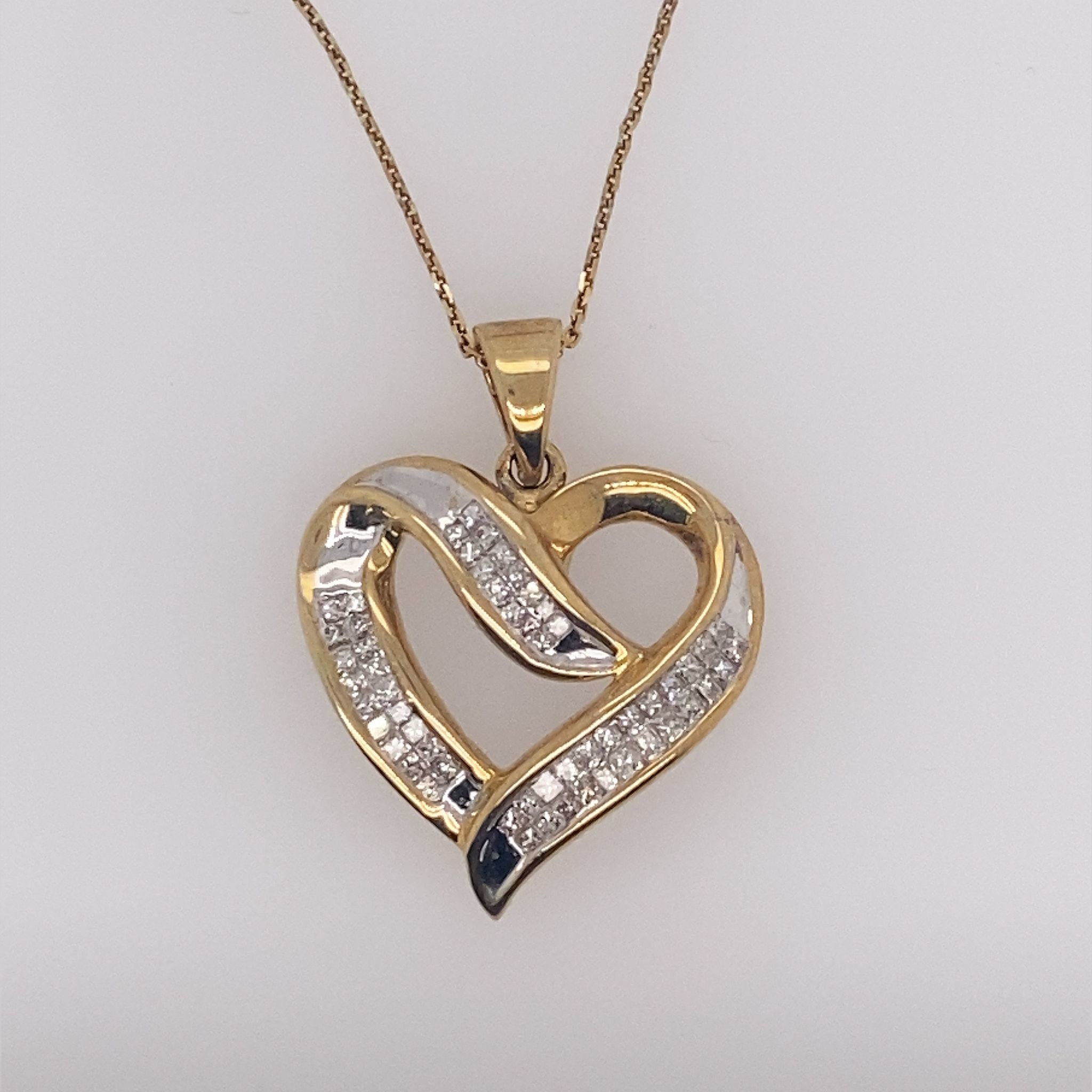 71019 10K YELLOW GOLD .50CT DIAMOND PRINCESS CUT OPEN SWIRL HEART PENDANT