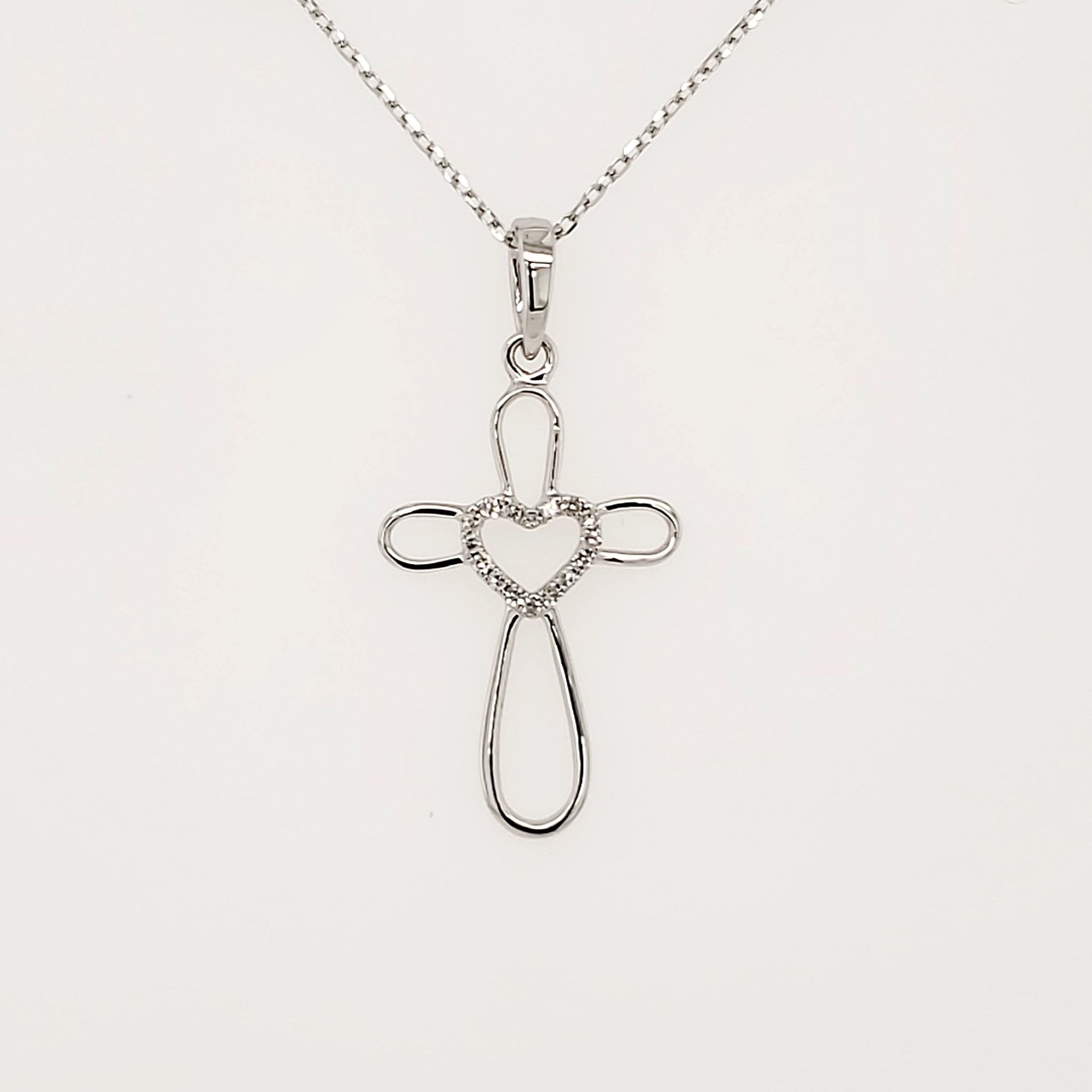 75013 14K WHITE GOLD .05CTW DIAMOND WITH HEART CENTER OPEN CROSS PENDANT 75013 14K WHITE GOLD .05CTW DIAMOND WITH HEART CENTER OPEN CROSS PENDANT
