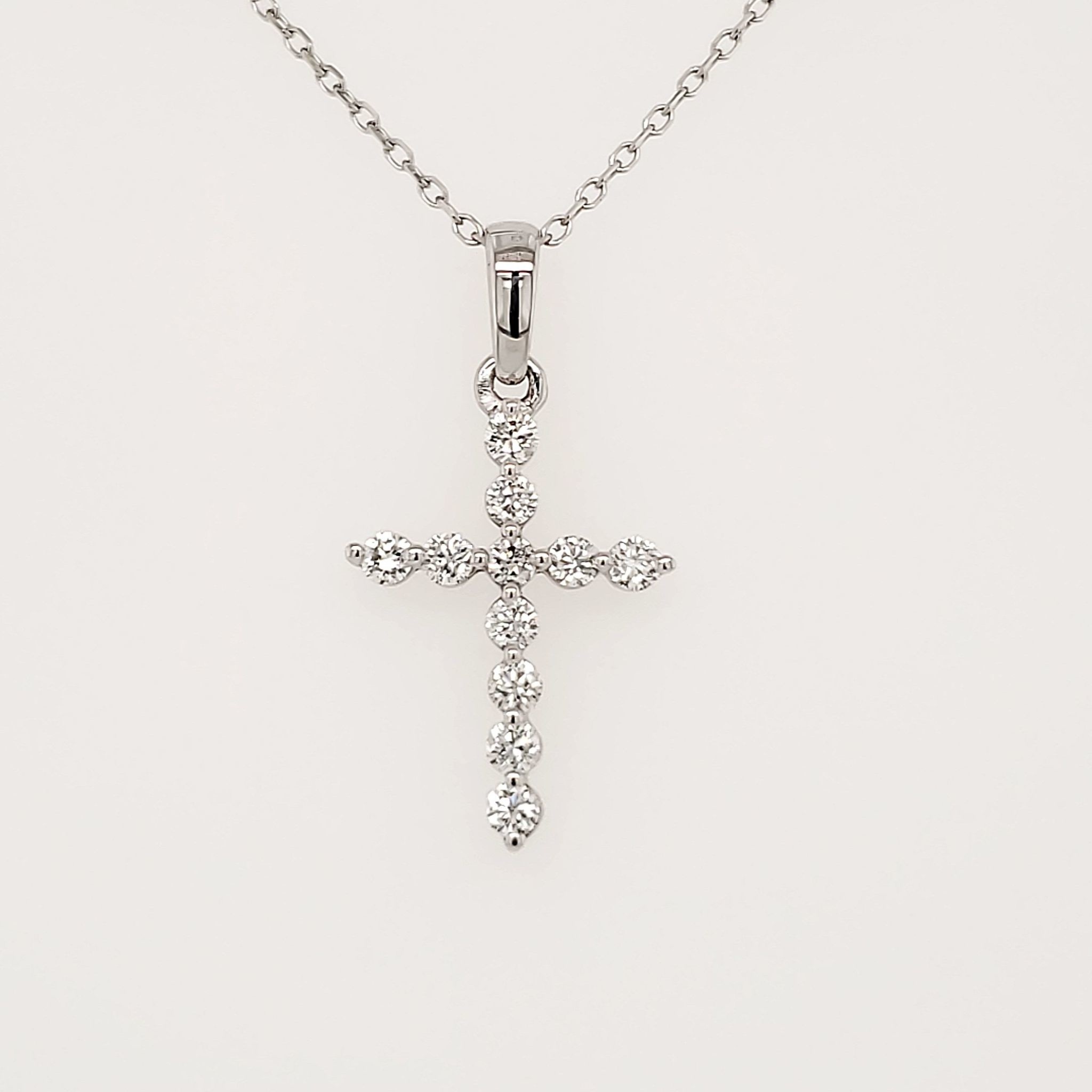 75009 14K WHITE GOLD .22CTW DIAMOND SHARED PRONG CROSS
