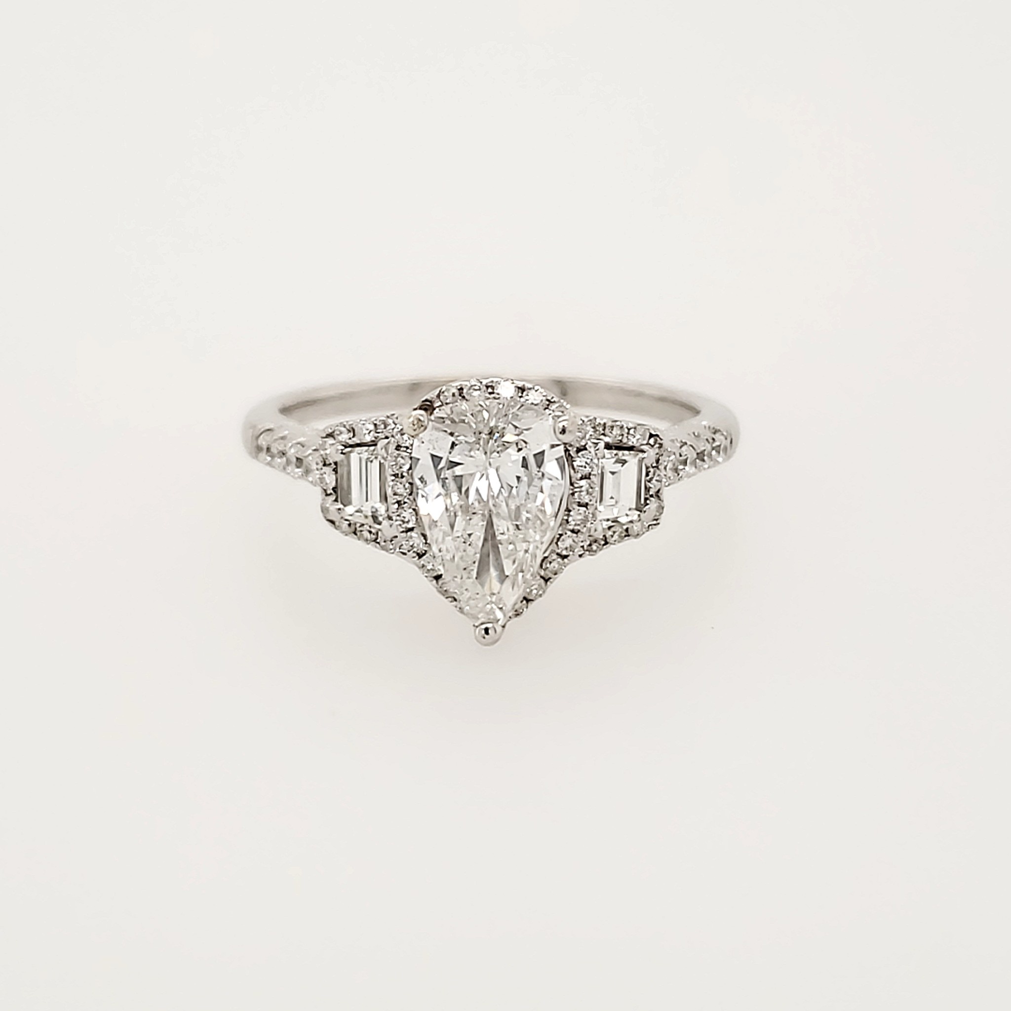 475033 14K WHITE GOLD 1.37CT HALO SETTING CENTER .91CT PEAR SHAPE AND BAGUETTE ON SIDES DIAMOND ENGAGEMENT RING
