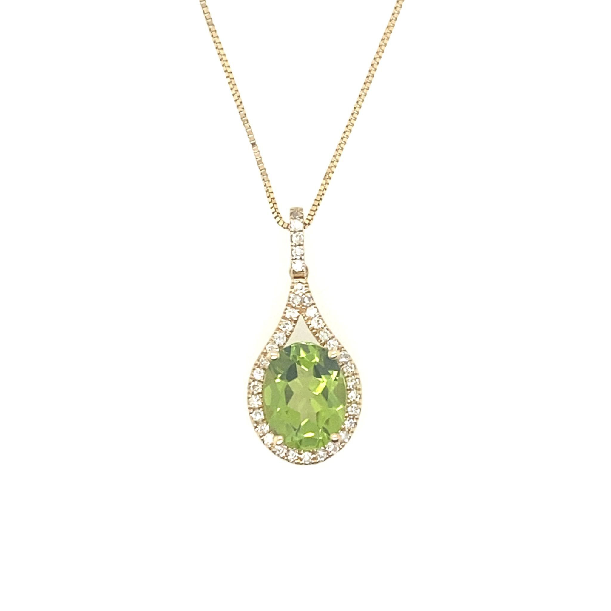 71247 14K YELLOW GOLD .25CT DIAMOND HALO & OVAL PERIDOT PENDENT