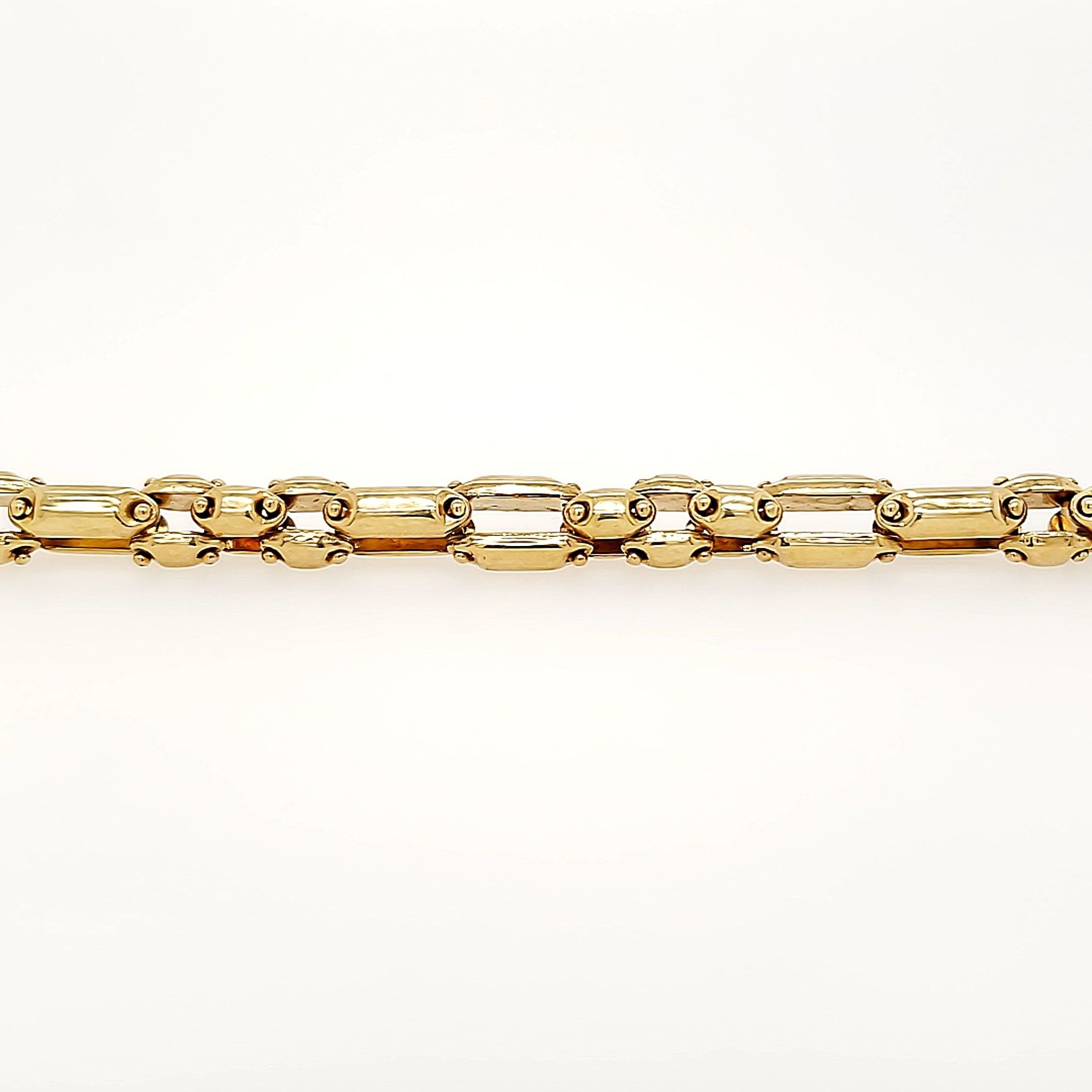 25037 14K YELLOW GOLD 7MM MECHANICAL LINK MENS BRACELET