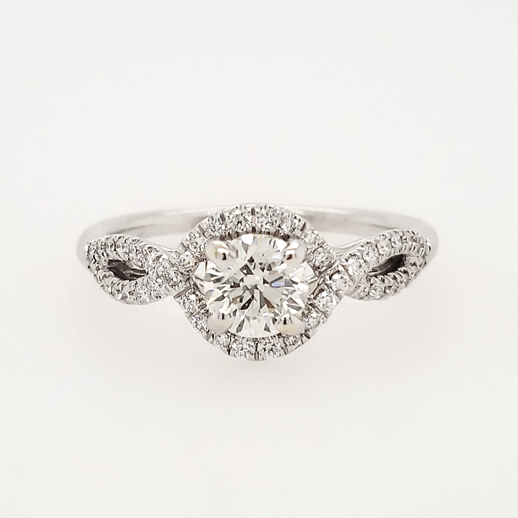 476608 14K WHITE GOLD .72TCW H SI1 ROUND DIAMOND CENTER WITH HALO AND .50TCW TWISTED MOUNTING DESIGN ENGAGEMENT RING