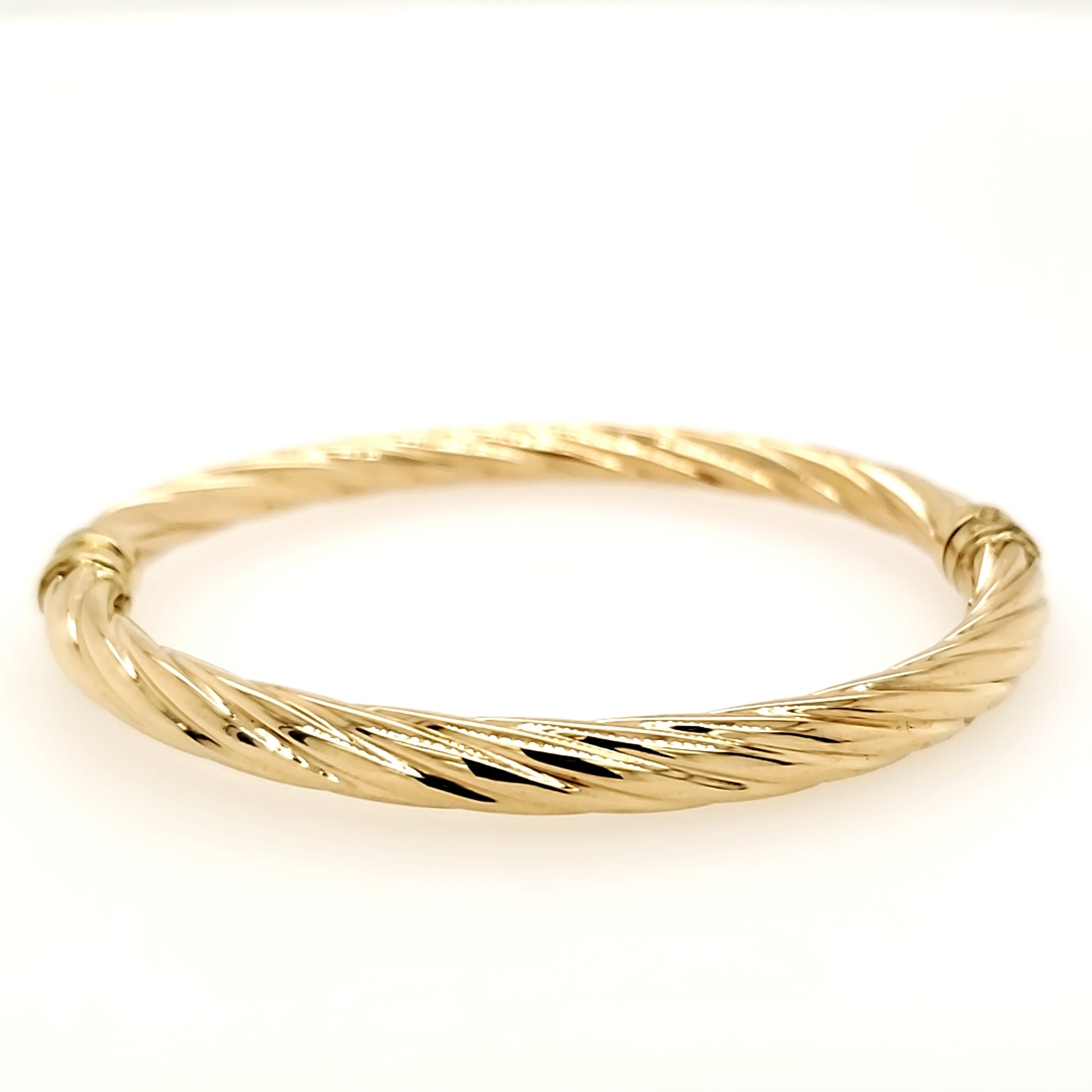20125 14K YELLOW GOLD TWISTED DESIGN BANGLE BRACELET