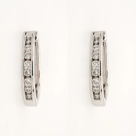 31128 14K WHITE GOLD .20CTW DIAMOND CHANNEL SET OVAL SMALL HOOPS