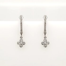 31215 18K WHITE GOLD .18CTW DIAMOND OVAL  HUGGIE WITH DANGLING BEZEL SET FLOWER SHAPE EARRINGS