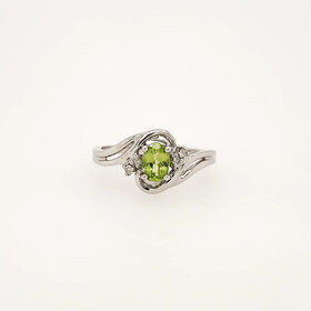 40413 10K WHITE GOLD OVAL PERIDOT WITH DIAMOND ACCENTS LADIES RING