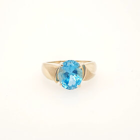 40466 10K YELLOW GOLD OVAL BLUE TOPAZ LADIES  RING