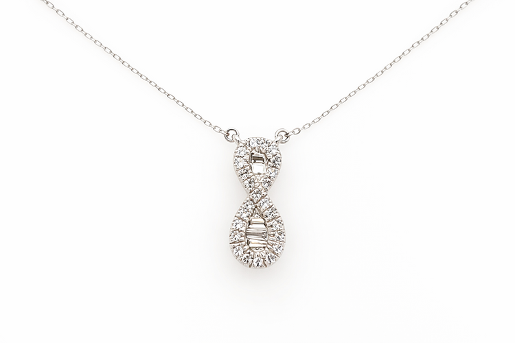 70772 10K WHITE GOLD .18CTW DIAMOND BAGUETTE PETITE INFINITY NECKLACE
