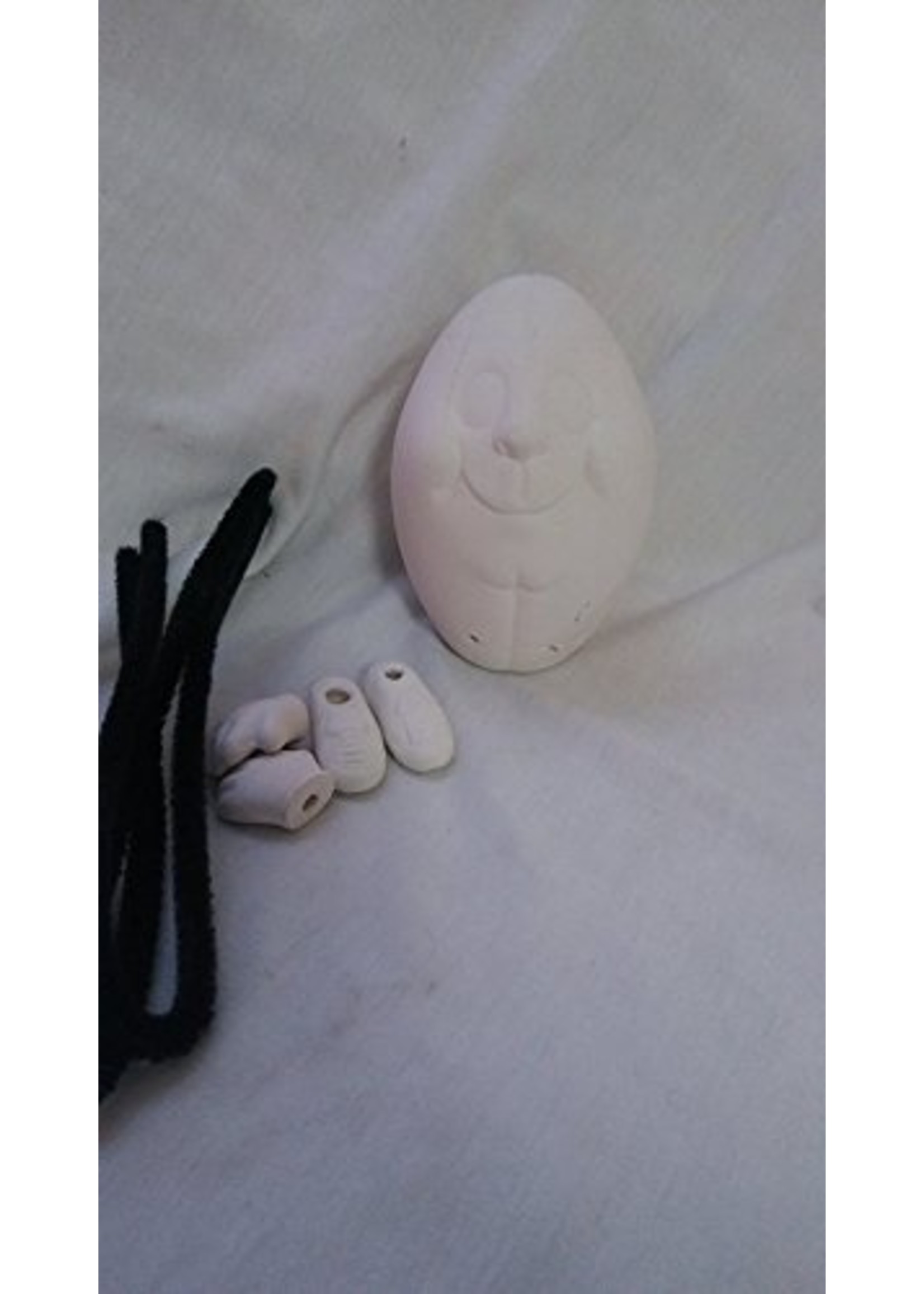 Creative Kreations Ceramics and Gifts Football noggin with hands and feet ready to paint ceramic bisque