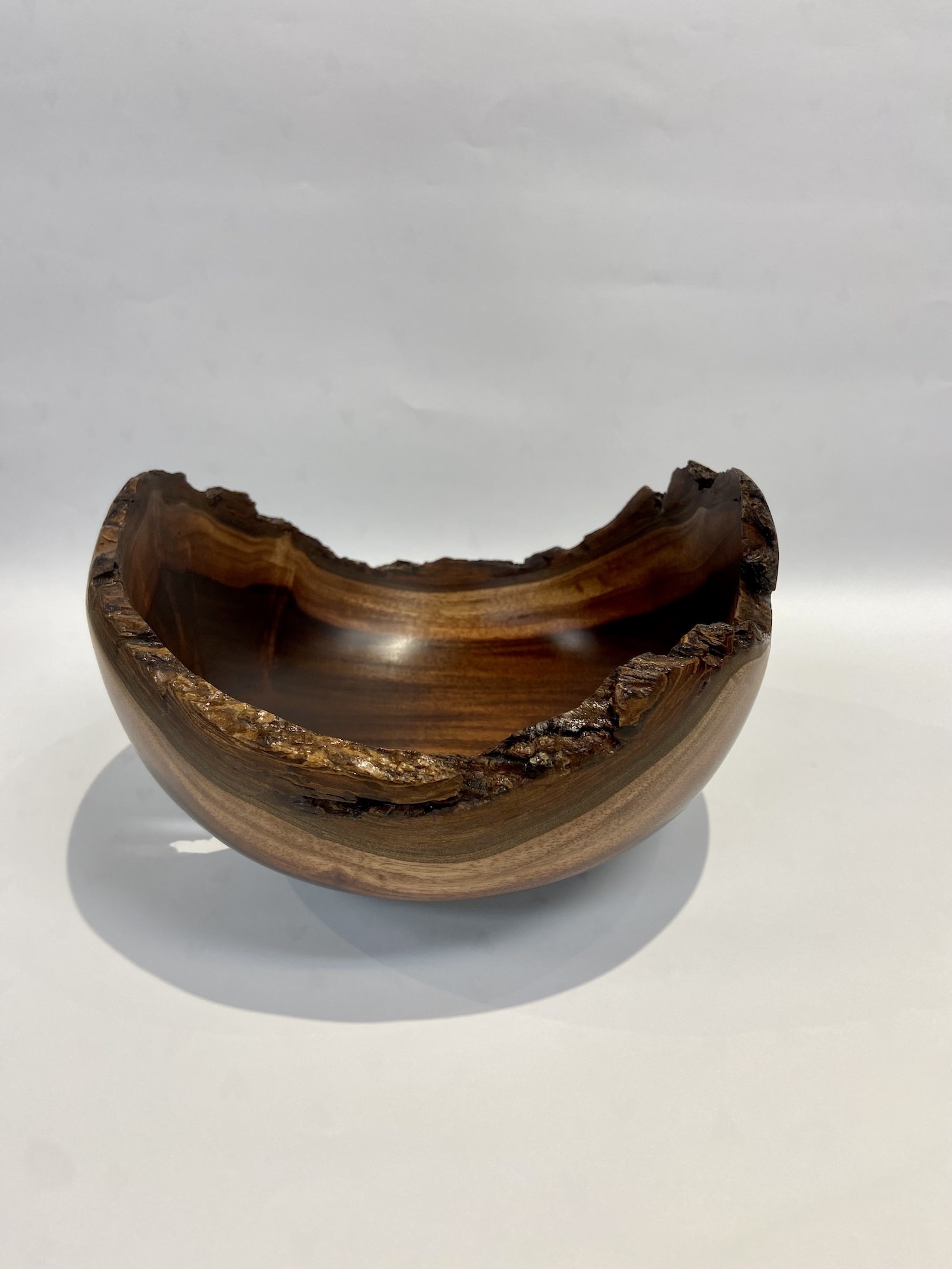 New crop hazelnuts in ceramic bowl with nut crusher on the wooden