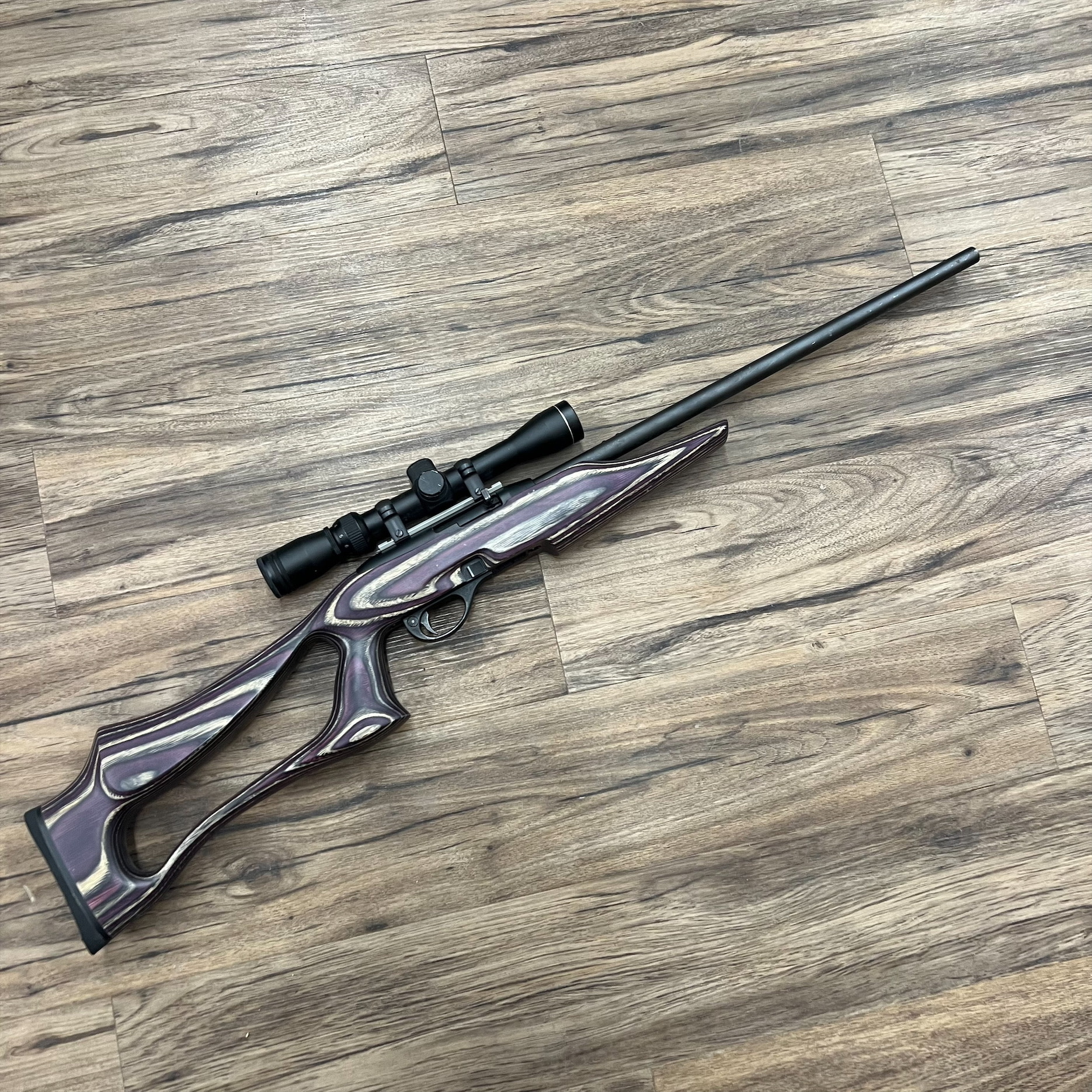 REMINGTON REMINGTON 597 RIFLE, SEMI AUTO, LAMINATE STOCK, W/ SCOPE, PRE OWNED