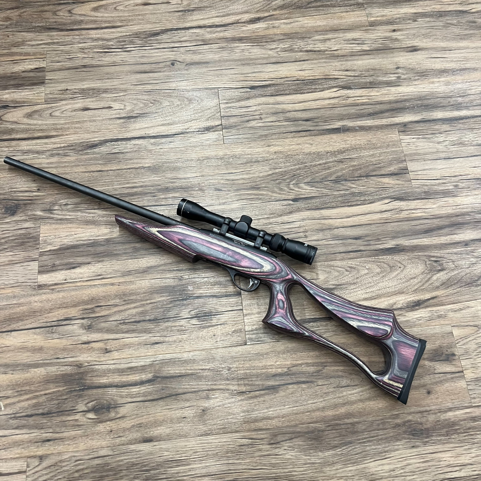 REMINGTON REMINGTON 597 RIFLE, SEMI AUTO, LAMINATE STOCK, W/ SCOPE, PRE OWNED