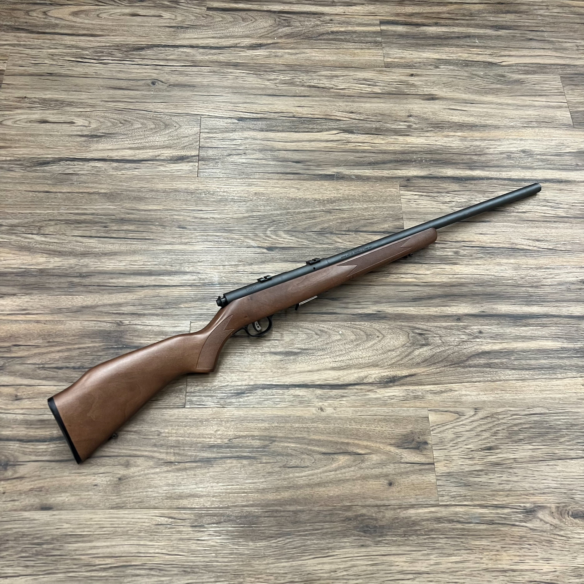 SAVAGE SAVAGE 93R17GV RIFLE, 17 HMR, LEFT HAND, WOOD STOCK, HEAVY BARREL, PRE-OWNED